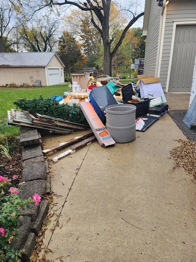 Dumpster being loaded with debris for Demolition Dumpster Rental in South Londonderry